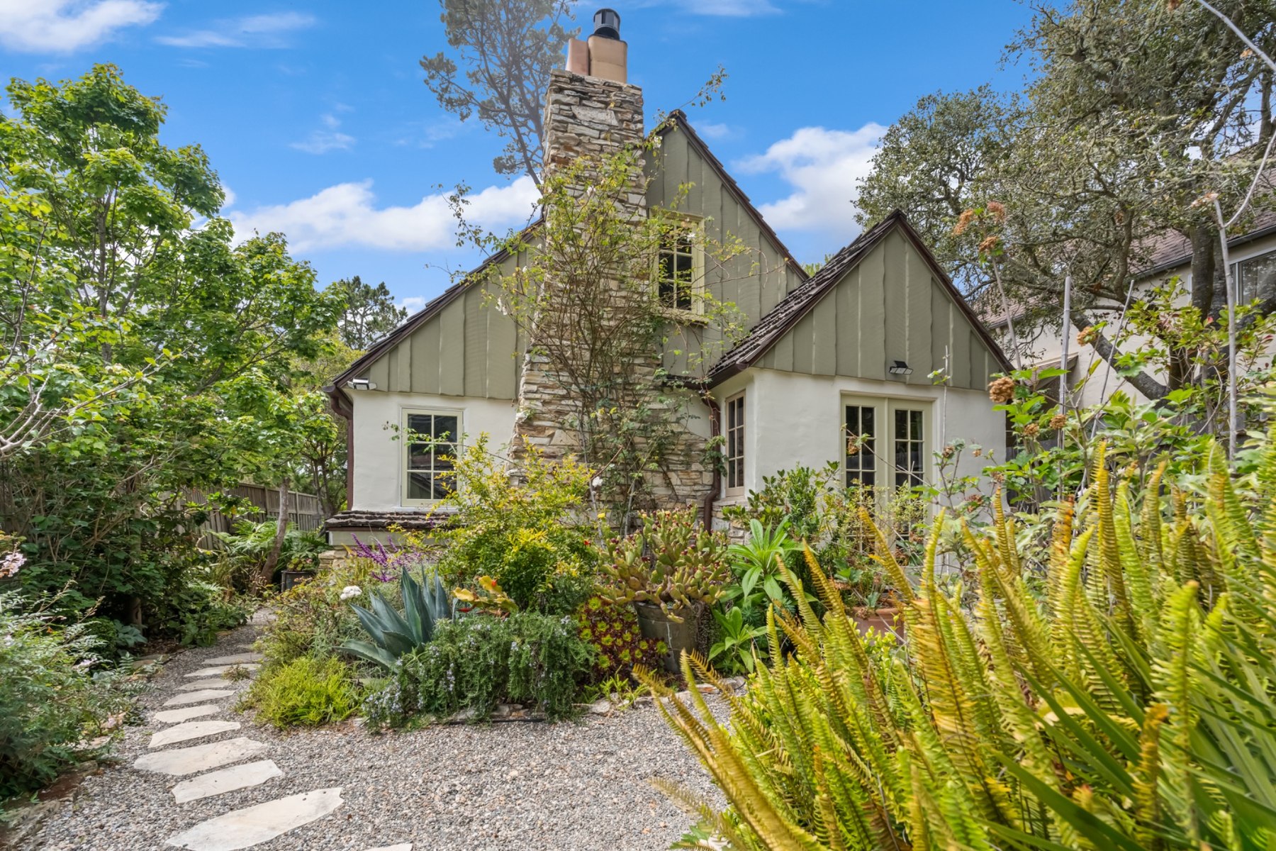 Main house storybook exterior and garden path at Twin Briar Cottage